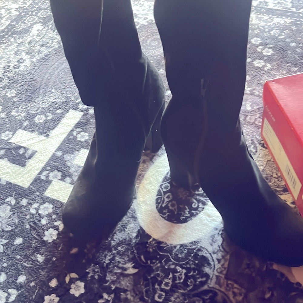Above knee soft heeled boots